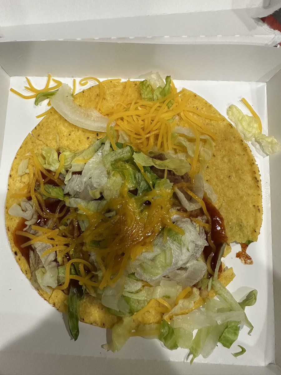 gcman's tweet photo. @tacobell …really bad look for the new Decades menu. Got this from Windsor,CO location…barely half the tostada is covered and it’s all cracked too! https://t.co/BtrNRMBhhL