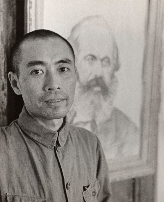 Maoistposting's tweet photo. Zhou Enlai posing infront of a Karl Marx poster hung at the Hankou headquarters of the Communist Party of China, 1938 (photograph: Robert Capa). https://t.co/5dse1Xu0NE