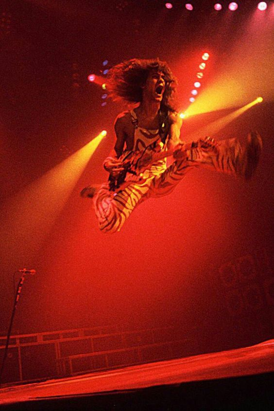 crockpics's tweet photo. Eddie Van Halen leaps during a concert. https://t.co/SA5RV4CEW6