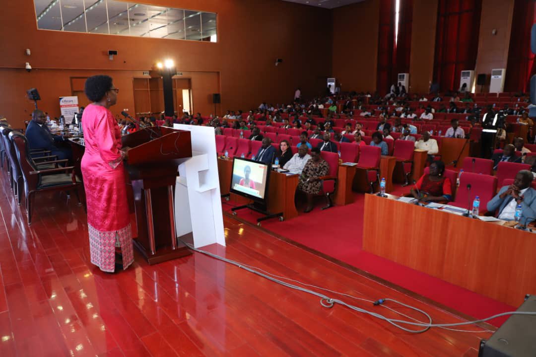 aidscommission's tweet photo. The Minister of Health, Dr. Jane Ruth Aceng, addressing participants at the National HIV & AIDS Symposium 2024, urging them not to celebrate the gains made in the HIV response but to re-double efforts to reduce the infection & to maintain those who are infected on treatment to achieve the goal of ending AIDS by 2030.

#EndAIDS2030Ug 
#WearTheRedRibbon
