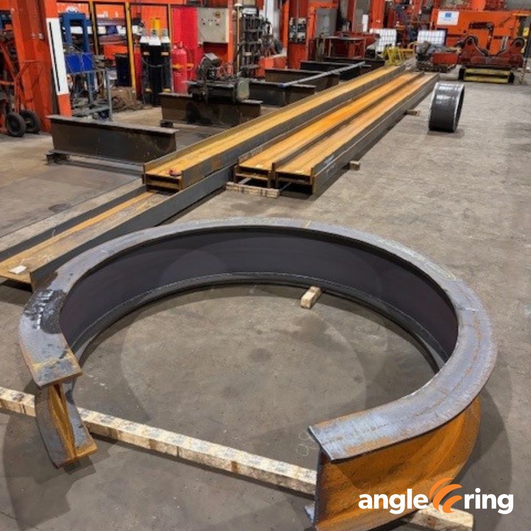 AngleRingCo's tweet image. Take a look at this latest job from the #AngleRing shop floor! We're working on bending a hefty 457 x 191 x 98kg/m UB sections to a precise 1160mm center radius with a 1900mm inside arc.  Learn more about our metal bending services: anglering.com/our-services/ #SectionBending