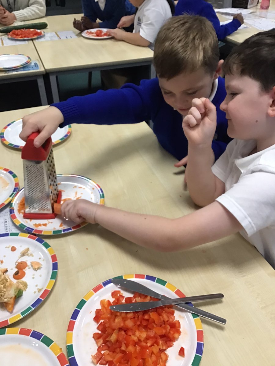 Year 2 are working hard to create our Greek Vegetable wraps. We can’t wait to serve them to you on Friday at our World Cafe! #DT <a href="/foxfield/">FoxfieldPrimary</a>