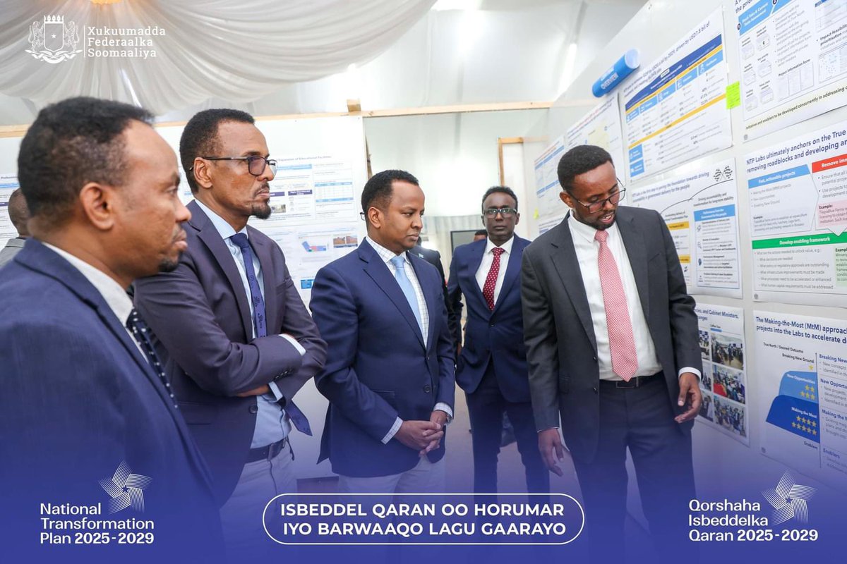NTPSomalia's tweet photo. Somalia’s Deputy PM @AbdisalamDhaay visited the National Transformation Plan center, assessing the 2025-2029 plan’s progress. Alongside Planning Minister @HonBeenebeene , he emphasized tackling national challenges and fostering sustainable growth. #SomaliaNTP https://t.co/zLlilrUV7A