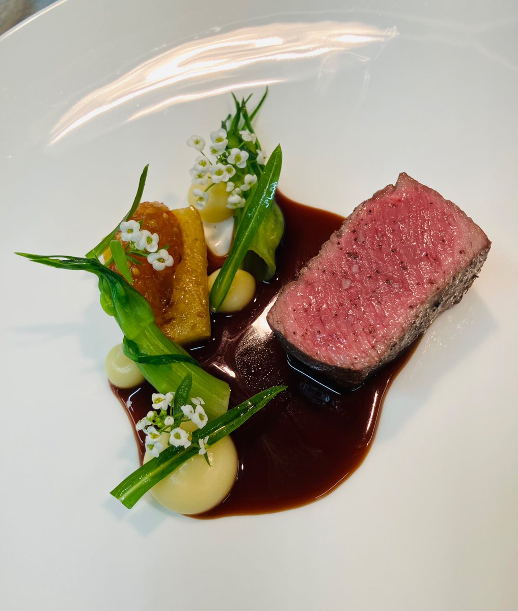 Roasted venison loin, creamed parsnip, puntarelle, spiced pear and pickled mustard seed condiment, red wine venison Sauce