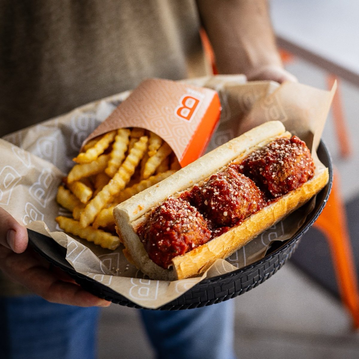 The family meatball recipe, house-made marinara, and fresh Turano bread—comfort food perfection. 🤤 Be prepared for a saucy bite worth savoring.
