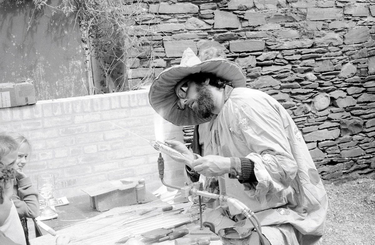 Some more fun on-site with young people in the 80's and 90's for this week's #ThrowbackThursday. Working in the trenches, cleaning small finds and glass-blowing lessons from a wizard! It is wonderful to see how vibrant and exciting excavation visits were then. #TBT