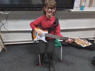 4T had the pleasure of listening to E play his electric guitar in school today. We loved hearing him and he was so proud to play for everyone!