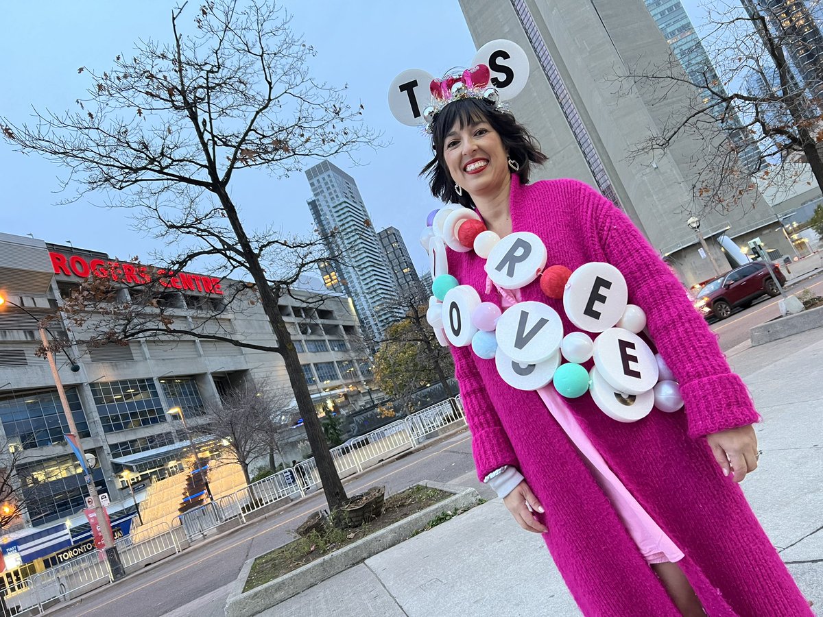 A Toronto Taylor Swift concert demands the proper outfit!  Tanya is wearing giant homemade friendship bracelets made from a pool noodle and painted styrofoam balls.  Tonight’s #ErasTour concert is a family affair with her husband and their two daughters.