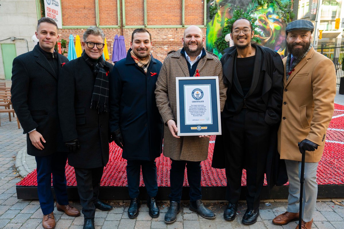 CANFAR's tweet photo. Yesterday we set the Guinness World Records title for the World's Largest Awareness Ribbon Mosaic made of awareness ribbons!  This beautiful mosaic is on display at Snider Plaza until #WorldAIDSDay for everyone to stop, reflect and remember that HIV is still here. @UNAIDS https://t.co/TWH8WvjPjl