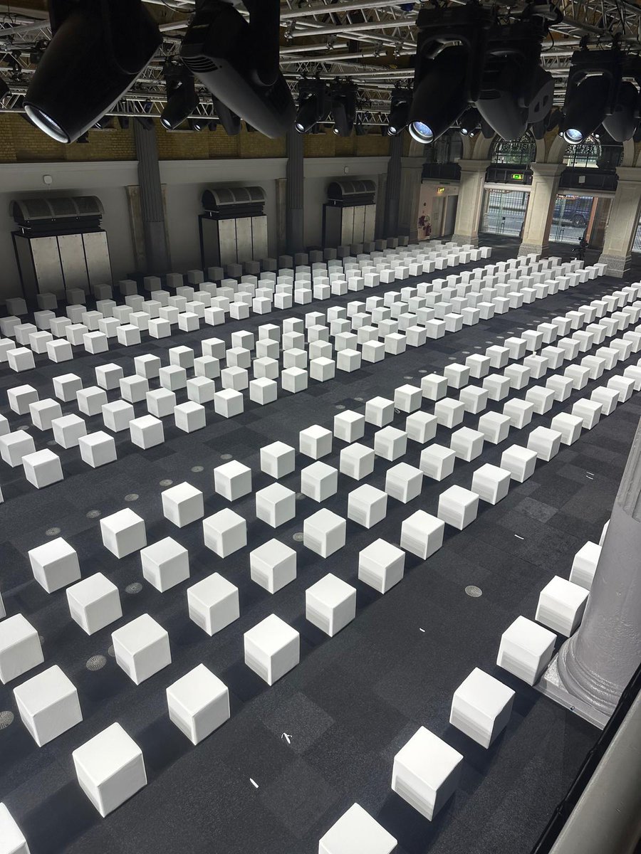 View of 570 white cube seats we manufactured for London Fashion Week bit.ly/3ObNYCh #footstools #LFW #seating #jwanderson @holmesproduction