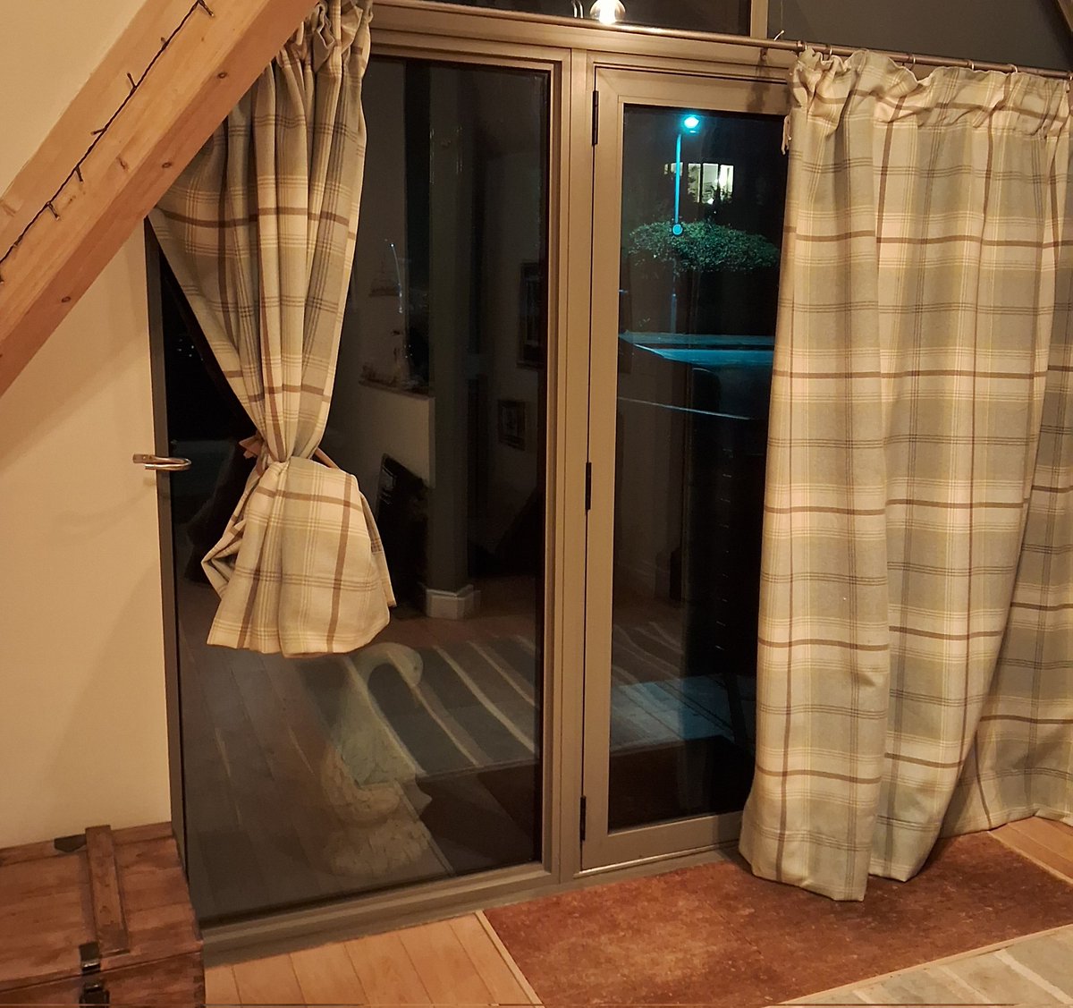 I like this one!
Using a pair of old tights to tie long, heavy curtains up out of the way of #flood water.