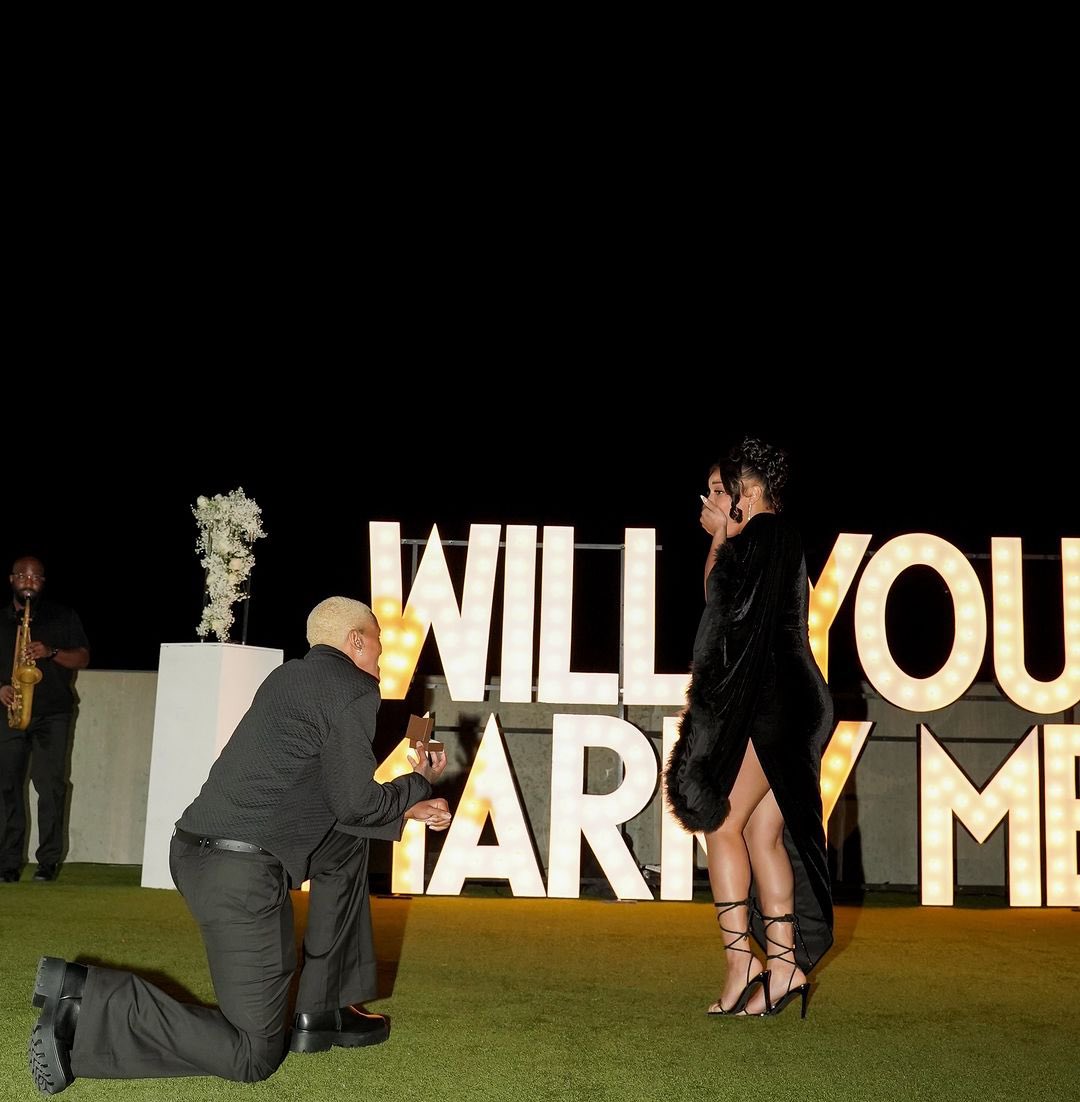 BrideNavy's tweet photo. “Love is in the air! 
Congratulations to Minnesota Lynx’s star, Courtney Williams, and her long-time love, N’Shya Seigle! 

Courtney popped the question in the most heartfelt way, surrounded by their nearest and dearest. 

Wishing them all the happiness in this new chapter!” https://t.co/kzRPLBVtzz
