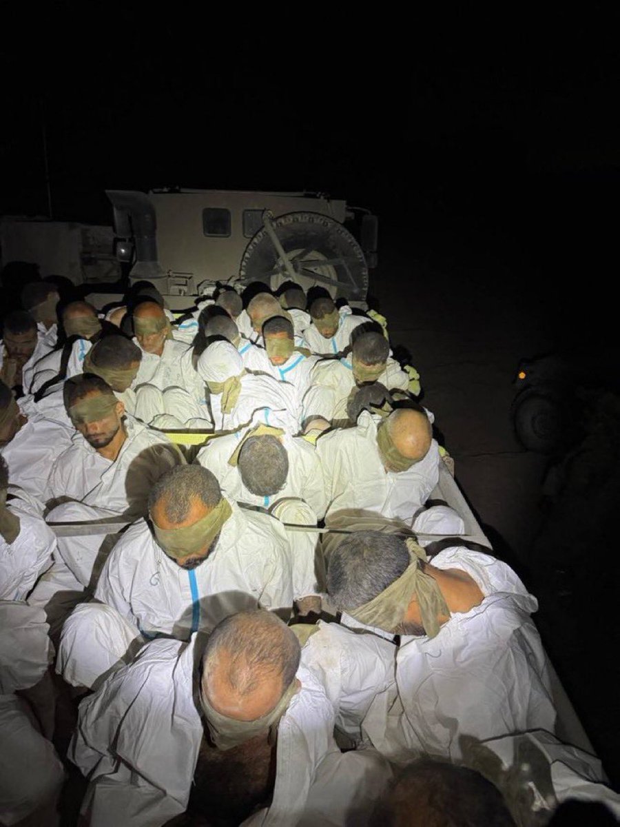 QudsNen's tweet photo. Israeli occupation soldiers released a picture of blindfolded and handcuffed Palestinians they kidnapped from the Jabalia refugee camp in northern Gaza. https://t.co/isnzaieU5Z