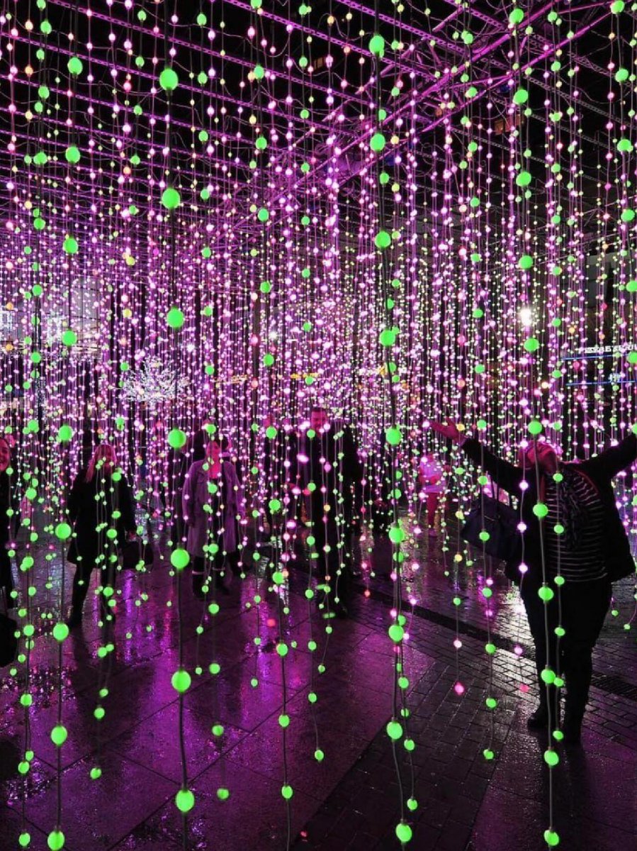 As individuals traverse this room illuminated by mesmerizing purple  lights, they become part of a unique visual journey that transcends the  ordinary. 💜🌟