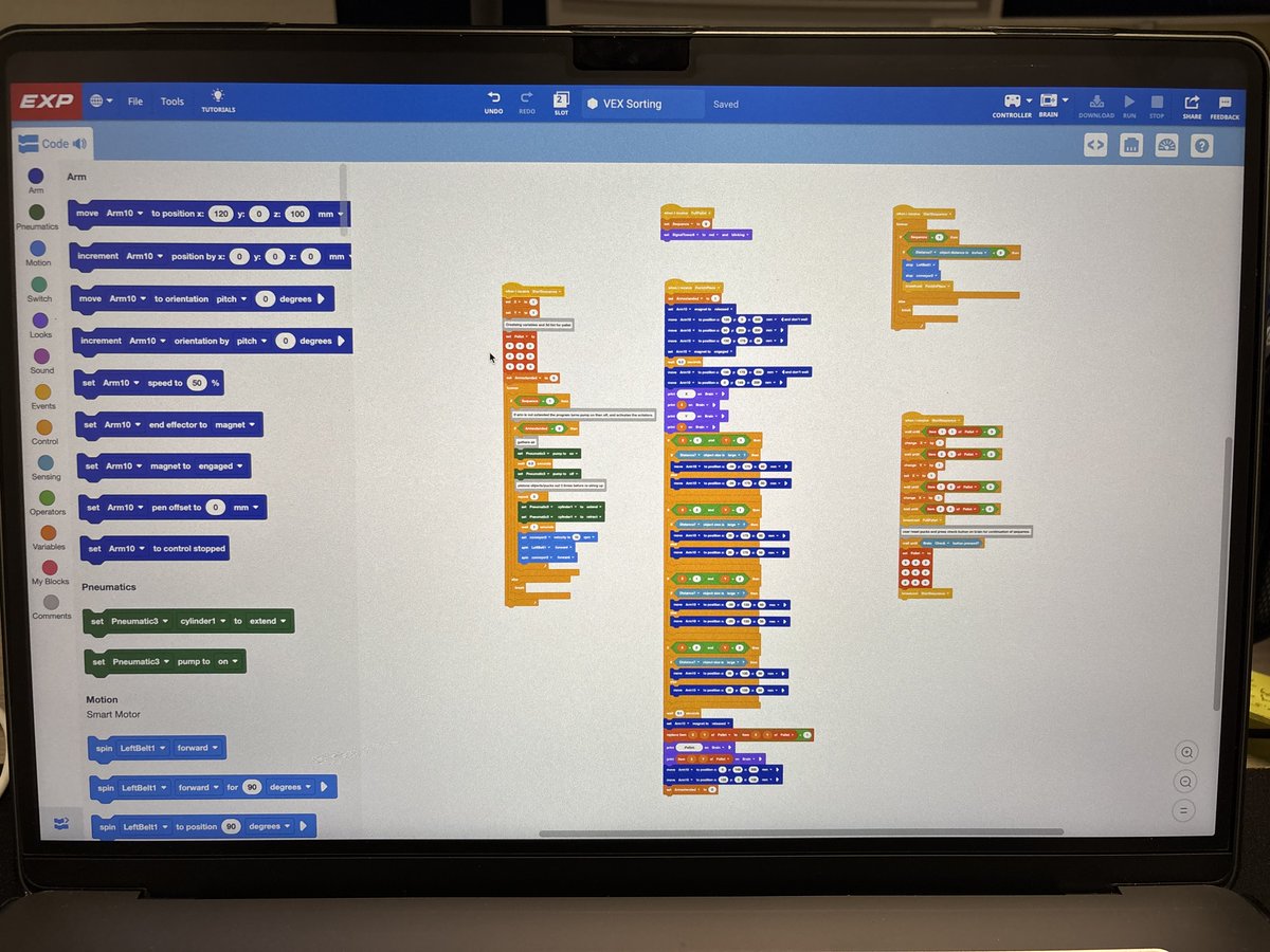 TechnologyBCS's tweet image. BCHS Senior, Denny Gardner and @PIE_Center_BCS Mechatronics teacher Dak Keylon work to create an automated sorting program on a VEX CTE Workcell, as a part of the Motor Controls and Practicum classes. This equipment is on loan from the new BCS STEM Hub lending library. #STEMHub