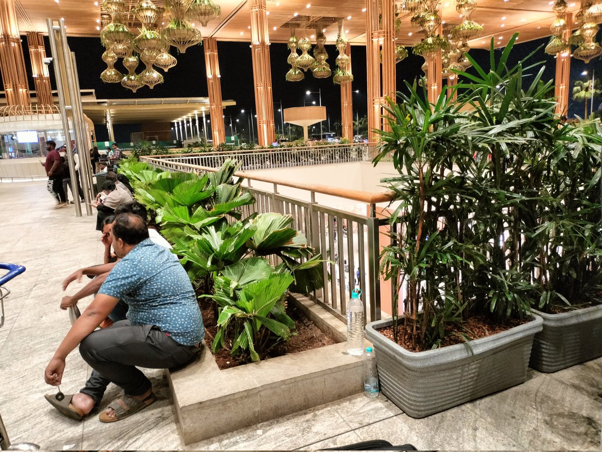 Lolita_TNIE's tweet photo. Terminal 2 of @BLRAirport hardly has any seating space for the public. Fabulous exteriors but the terminal lacks a basic amenity found even in roadside bus stops like chairs. Ppl were seen squatting wherever they could find a little space on Thu night. Many were seen standing for long
 @DGCAIndia @NewIndianXpress