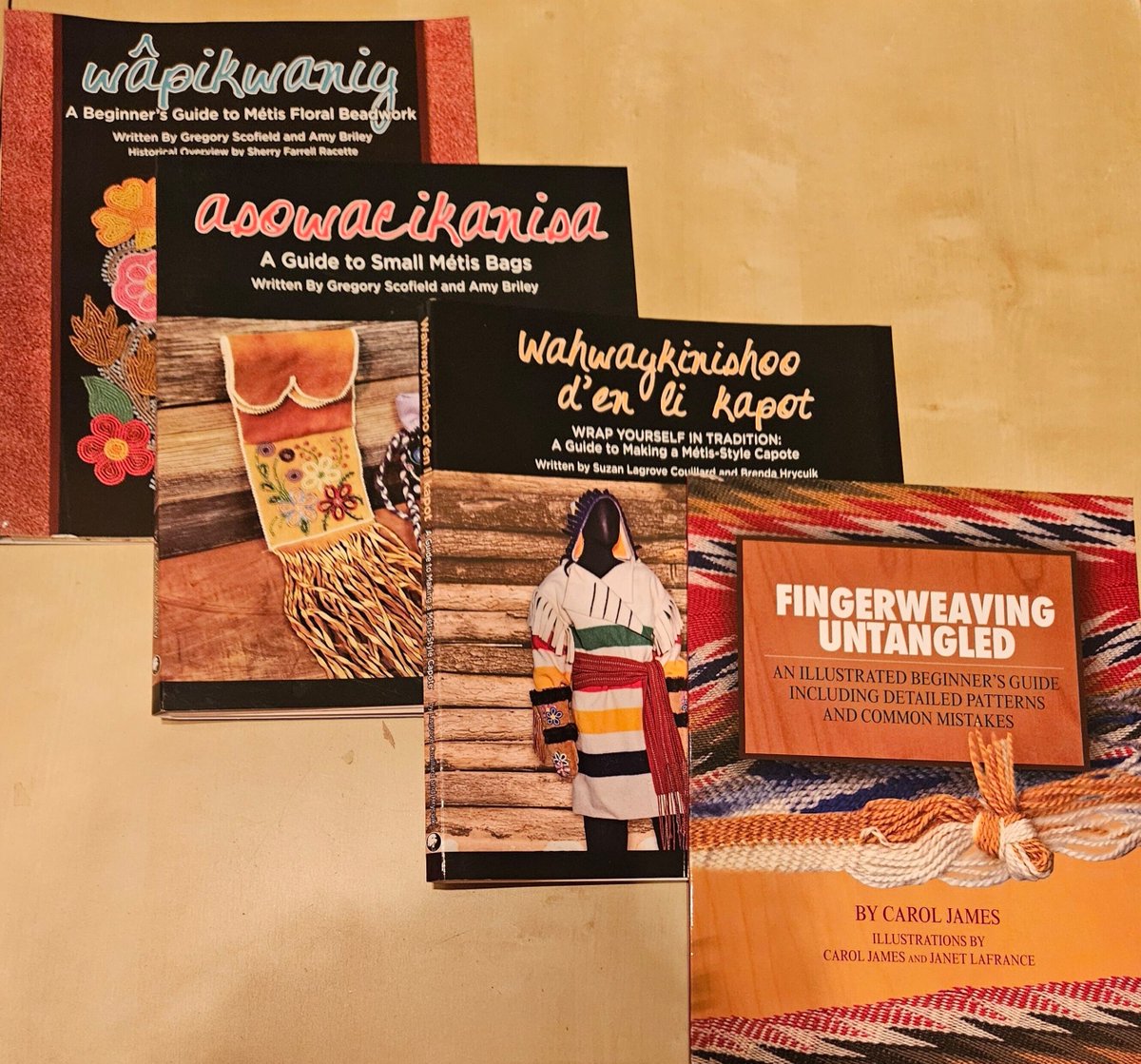 Learn about Métis culture &amp; art hands-on through these fantastic guides on wâpikwaniy: Floral Beadwork, asowacikanisa: Small Métis Bags, wahwaykinishoo d'en li kapot: Métis-Style Capote &amp; Fingerweaving. All available in-store &amp; online at the Musée Héritage Museum shop. #metisweek
