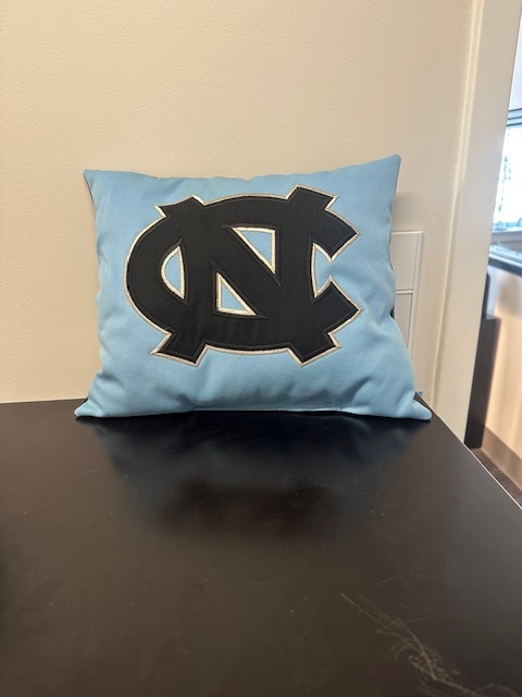 ICYMI: <a href="/UNC_Bands/">UNC Bands</a> is selling these interlocking NC pillows made from the shields of our old uniforms. A great piece of history + a great way to support the band! 🩵

Order now: bands.web.unc.edu/current-studen…