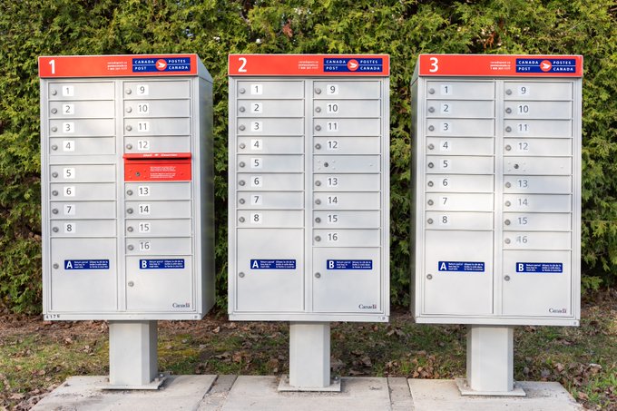 Three Canada Post neighbourhood mailboxes.