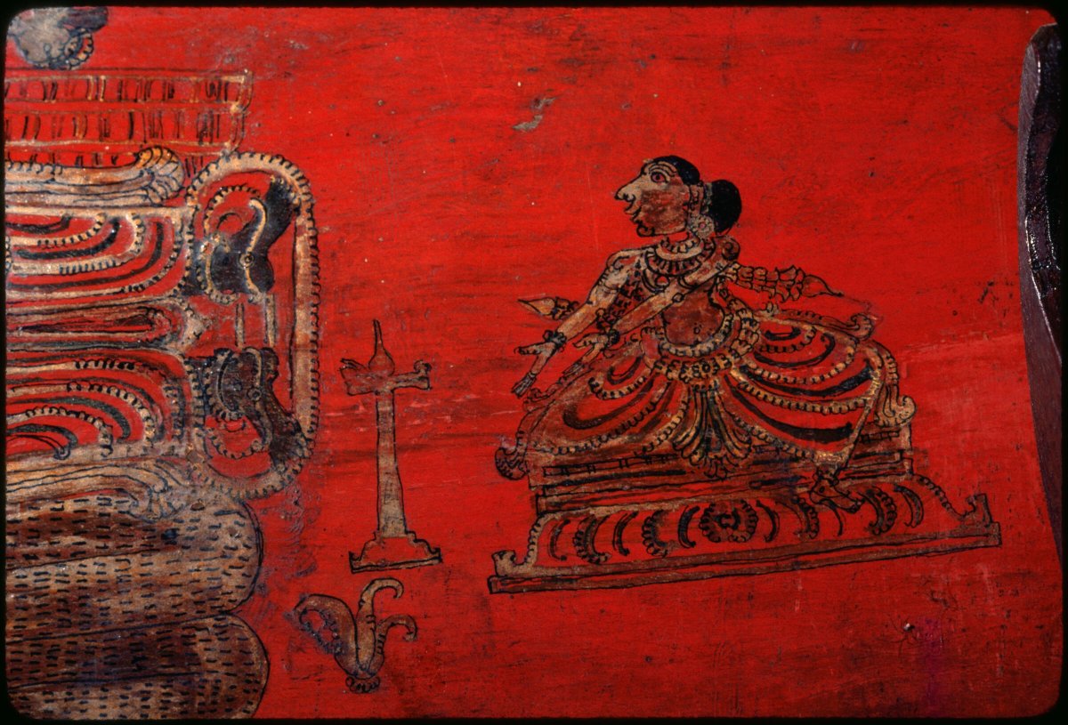 iconographile's tweet photo. I believe this is Lakshmi with a 'candlestick' that may actually be an oil lamp stand. 
I cannot figure out what is the object that looks like the Buddha's hand fruit. It appears on both sides of Vishnu.

Hope you will enjoy these images as much as I do! https://t.co/akp4fgvSqh