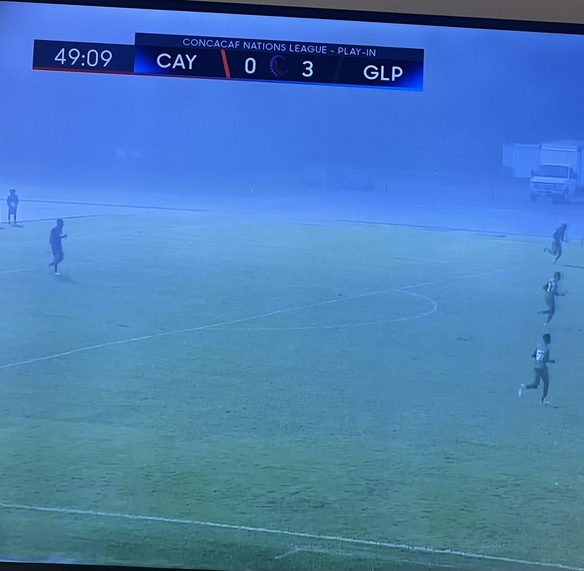 PrinceofPicks10's tweet photo. Guadeloupe &amp; Cayman Islands are playing in a damn hurricane lol….

Outdoor Futbol in the fall is something else 👀 

Any shot on target should be a goal, idk how the keeper is supposed to see the ball coming https://t.co/U7UxRe2sNT