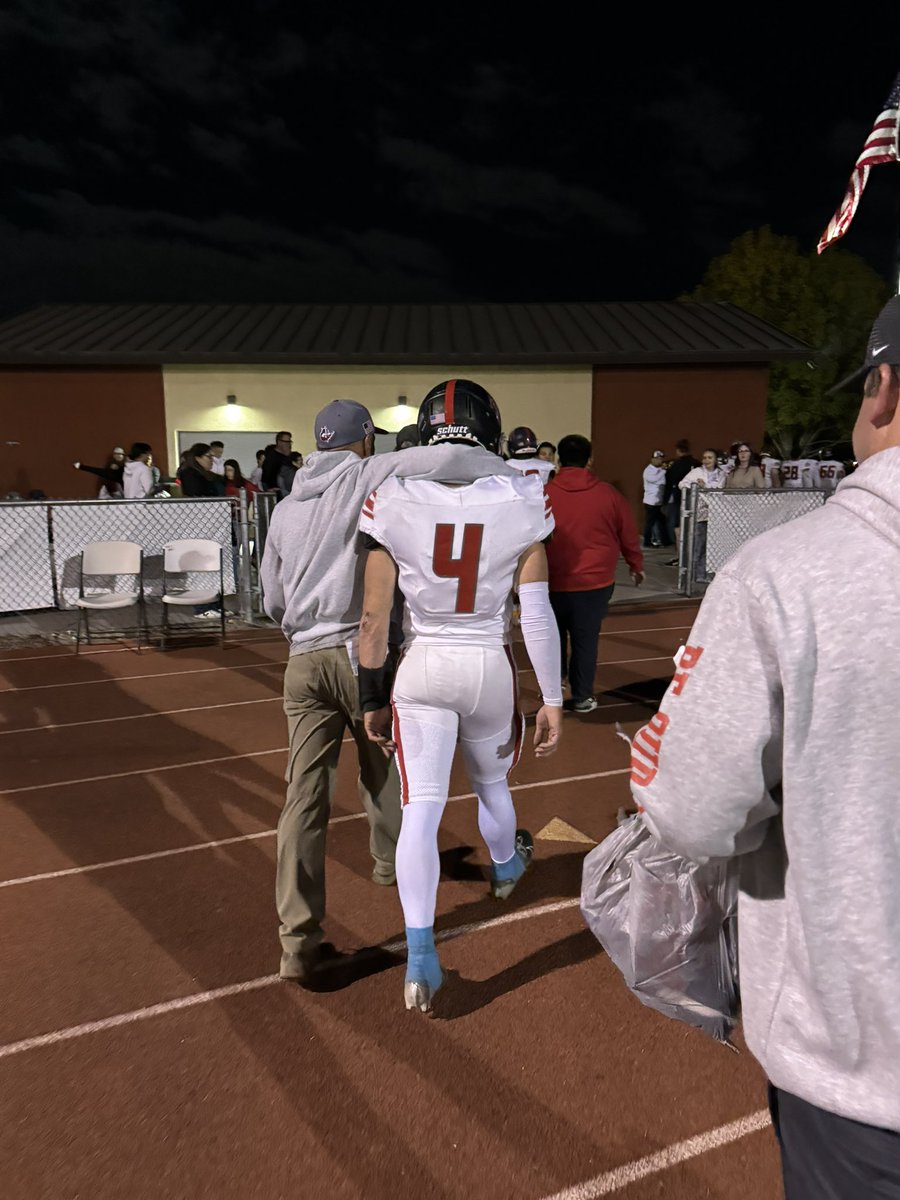 Head coach Loren Dawson and senior quarterback Jett Brewster walk off the field together. 

Dawson has helped turn the ALA-Ironwood football program around, and Brewster played a huge roll on the field. 

A great moment between a coach and his QB.