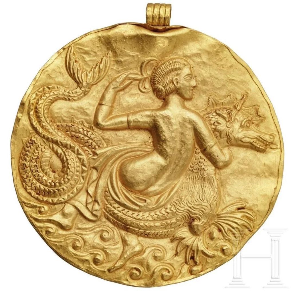 – A Nereid riding a sea monster 

The best known of the Nereids were Amphitrite, consort of Poseidon; Thetis, wife of Peleus and mother of the hero Achilles; and Galatea, a Sicilian figure loved by the Cyclops Polyphemus.

Hellenistic Greek gold medallion 

3rd century B.C.