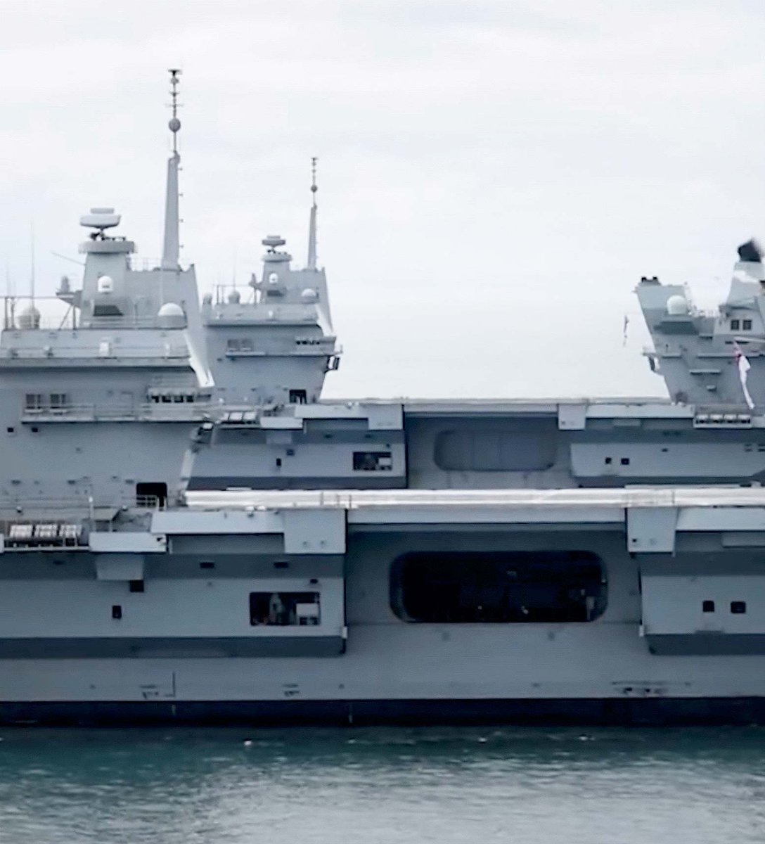 NavyLookout's tweet photo. .@HMSQNLZ  and @HMSPWLS  met up briefly recently off the coast of the UK. The first time they have been in company at sea since 2021. 

Both conducting training with a few helicopters but the lack of embarked aircraft did not make for the best photo opportunity. https://t.co/htQ5RvWPMY