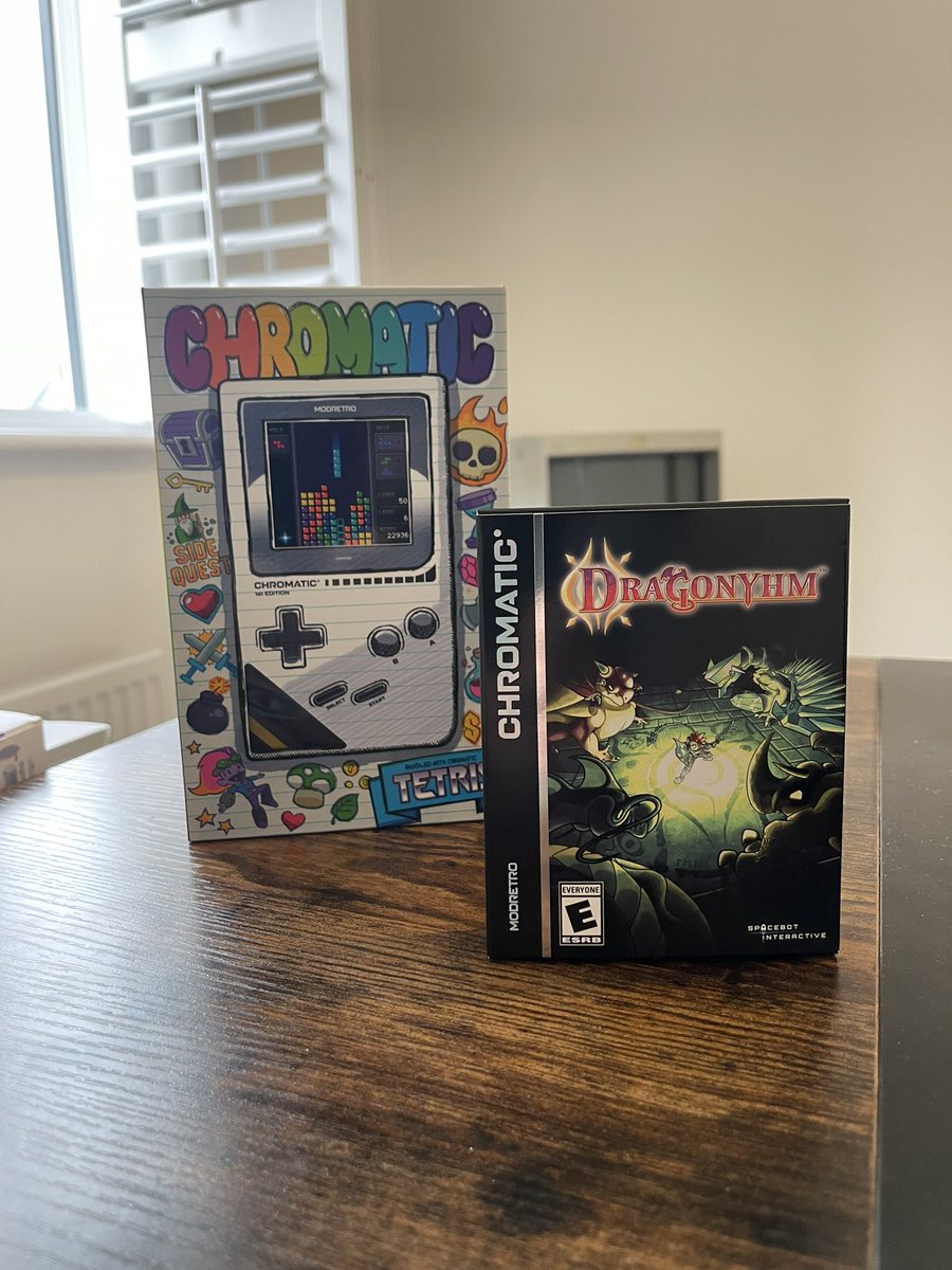 spacebot_dev's tweet photo. The pre-production Dragonyhm boxes came in and we couldn’t be happier. It’s surreal to see how good the game looks on the @modretro Chromatic. We’re so excited for everyone to start receiving their copies! #indiedev #IndieGameDev #indiegames #dragonyhm #RPG #spacebotinteractive #modretro #chromatic
