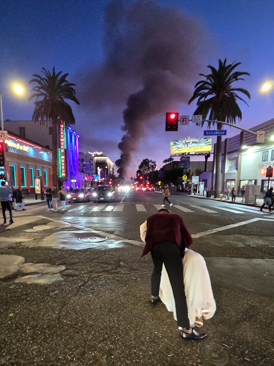 la_dorkout's tweet image. Today I was crossing Hollywood and Highland, where peds &amp;amp; tourists cheered a just-married couple celebrating in the middle of the intersection while a fire ravaged a strip mall down the street.

I've lived in LA my whole life, and this is the most LA candid I've ever snapped.