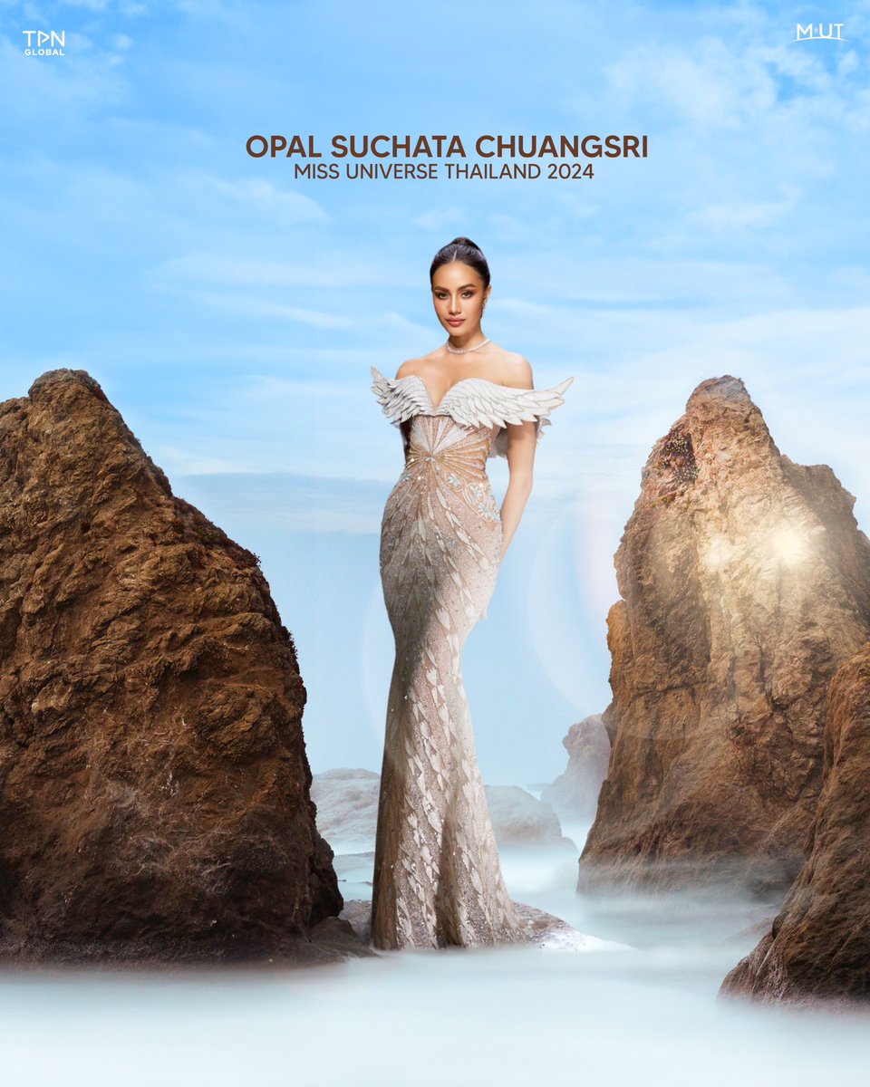 QUEEN’S WINGS OF TRIUMPH. 

Opal Suchata's gown for the Miss Universe 2024 stage is a stunning tribute to Thep Kinnaree, skillfully designed by Rian Fernandez with the opulence of gold and the purity of white. Crafted from luxurious micro sequin embroidery in shimmering gold and