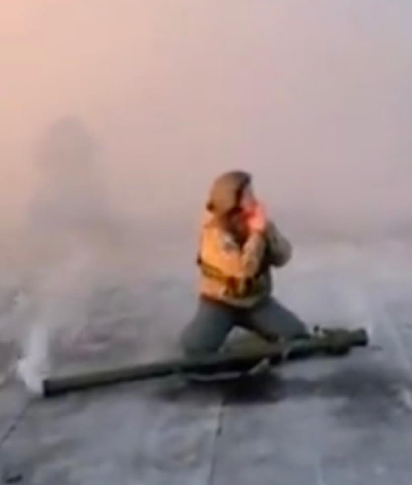 A frame from a phone video where a soldier, a former teacher in kindergarten, Natalia Grabarchuk, shoots to stop a Russian missile, puts the installation, which is still smoking, on the ground, and prays. Another Russian rocket will not hit a hospital or a kindergarten. 
For me,