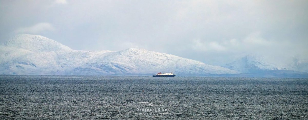 kmacraeplockton's tweet photo. Calmac's MV Hebrides below the snowy Harris hills this morning. 
The Harris Hills 30 miles, or so, away from where @SBPhotogrphy took this photo near Colbost on the Isle of Skye. https://t.co/REp1OgrD0h