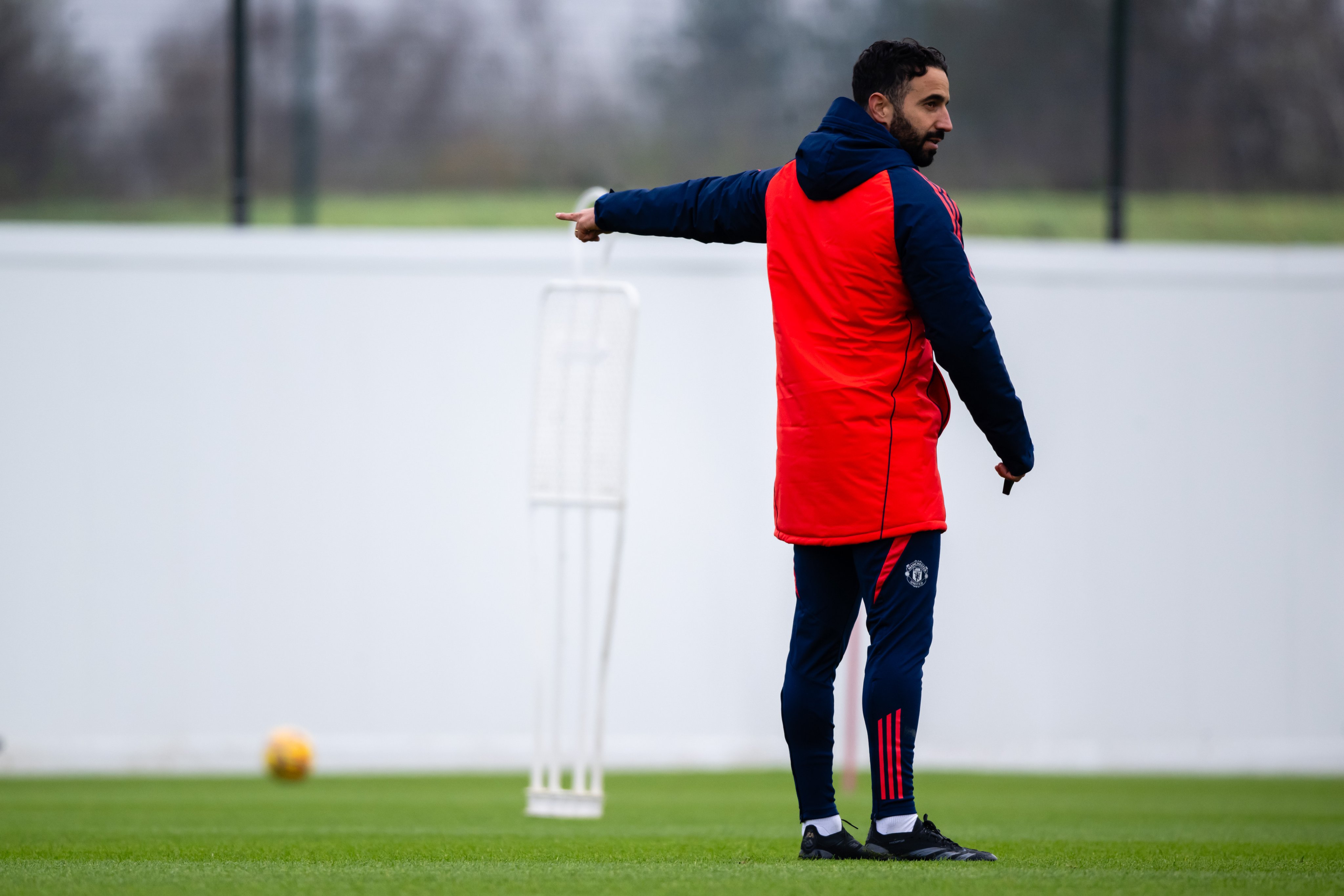 Ruben Amorim points during training.