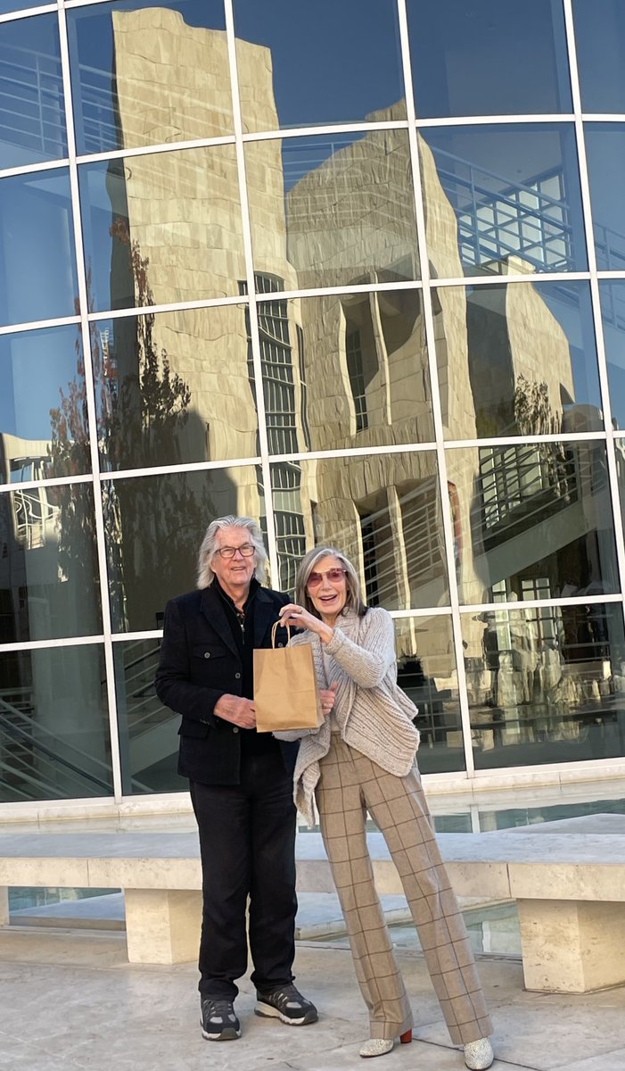 Thank you, my friends, for all your birthday wishes. That is the magnificent Getty museum behind us and that package is the gift of your friendship. Thank you again.