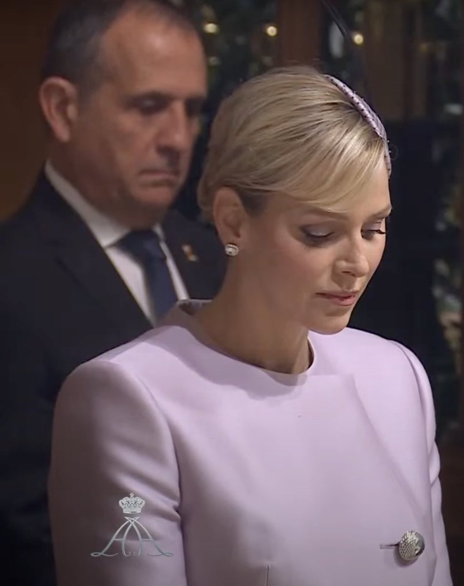 Princess Charlene is attending the Monaco National Day celebrations in Monaco today alongside Prince Albert.

Princess Charlene is wearing a custom pantsuit from Louis Vuitton in lilac. The suit is made of silk and is styled with a fascinator and black pumps.