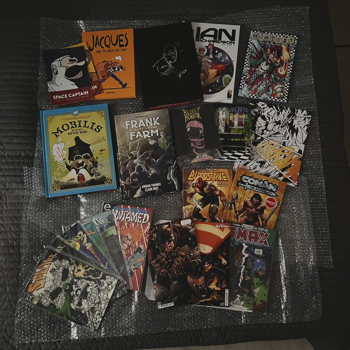 Thought Bubble + London haul! Includes birthday gifts from <a href="/JoebiWan94/">Joe</a> <a href="/WriterToby/">Toby Lawson</a> <a href="/ClassicXbooks/">@ClassicXBooks</a> and brilliant pickups from @erikapriceart Ian Richardson <a href="/marcusto/">Marcus To</a> <a href="/Jordan_J_Thomas/">Jordan Thomas - pre-order the MUGSHOTS TP now!</a> <a href="/juni_ba/">Juni Ba 🍉</a> <a href="/ChrisBaldie/">Chris Baldie doesn’t use this place anymore</a> <a href="/RECKLESS_IMBER/">CHRIS !MBER</a> and <a href="/ChrisManji/">Chris 'Human Cryptid' Mole ☀️</a> ‘s long awaited Majestic toilets anthology!