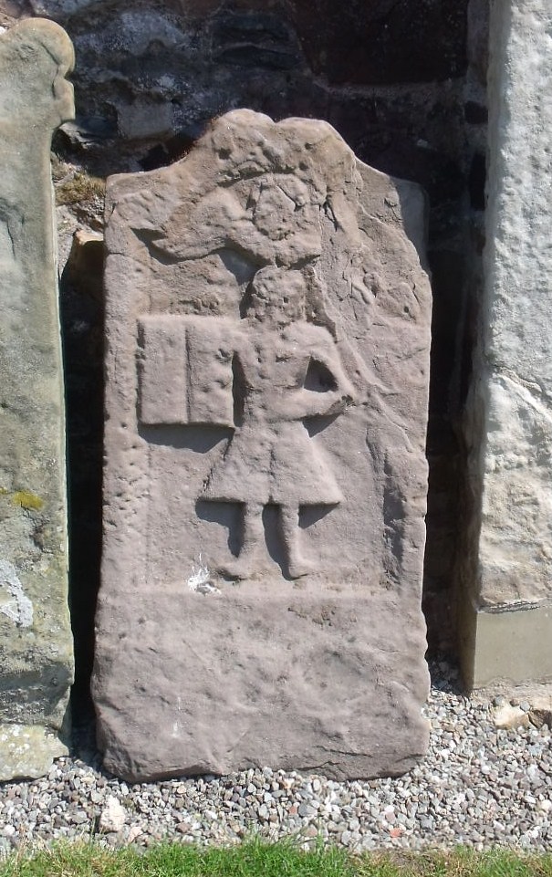 BordersFHS's tweet photo. Frosty mornings. Tablestones can be difficult to read but frost can sometimes make the carved lettering easier to read. #Volunteers out in all weathers to record #MonumentalInscriptions. Photo of symbolic stone for Robert Paxton dated 1722 at #Coldingham https://t.co/zaIh59Wsnv