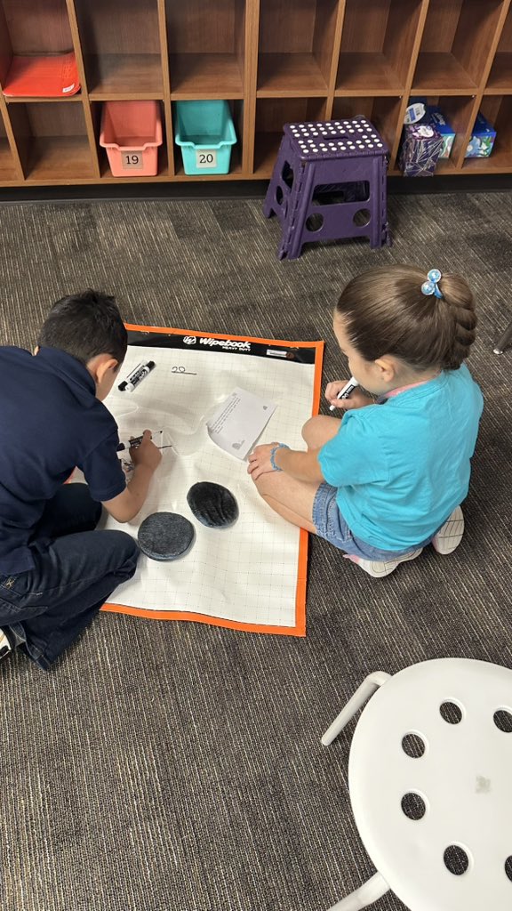 MrsMartinez71's tweet photo. My class loves using our wipebooks today to show how they solve word problems! 🎸🎸😍😍 @MJEjags @MJE2ndGrade https://t.co/goBaNtoppt