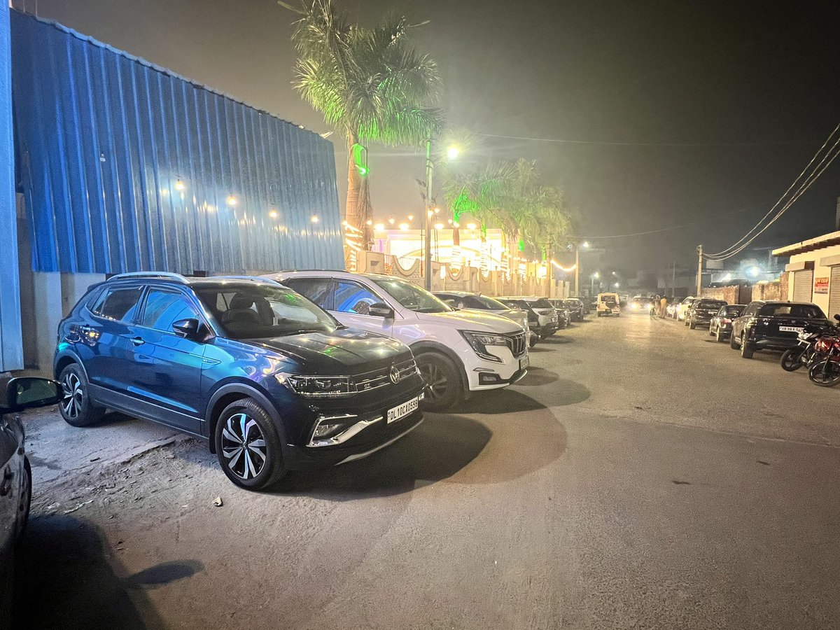alpine_shek's tweet photo. Dear @Uppolice , the blue Volkswagen in the photo is my car, parked in the designated parking spot outside JS Banquet in Noida sector 132. 30 minutes after parking I get an e-challan and the police car was standing close by who didn’t bother to respond to my queries. Any help??? https://t.co/MqIDtflJh0