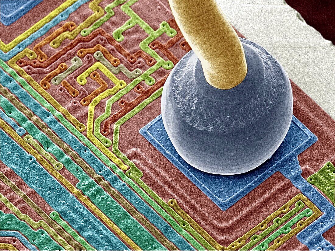 microscopicture's tweet image. bonded end of a micro-wire connected to a silicon chip. magnified 400x