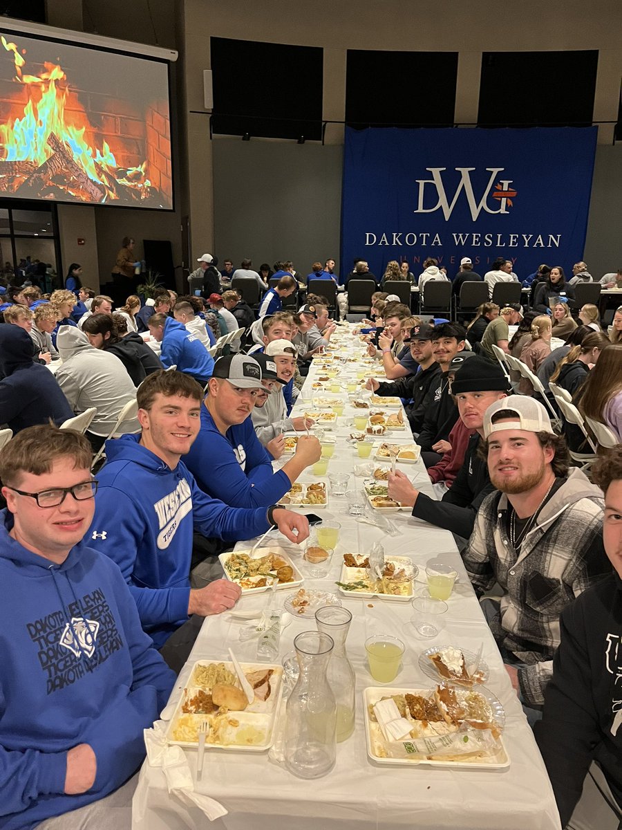 DWUBaseball's tweet photo. Annual Thanksgiving meal! Huge thank you to all DWU staff and faculty for serving the students tonight! Also a special night in announcing Tiger Baseball alum and current Assistant Coach, Reed Harter on being named to the South Dakota High School Baseball Hall of Fame in 2025! https://t.co/Fb71ZZKIGz