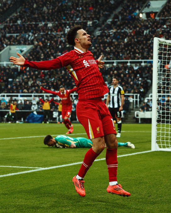 Photography of Curtis Jones celebrating his goal against Newcastle.