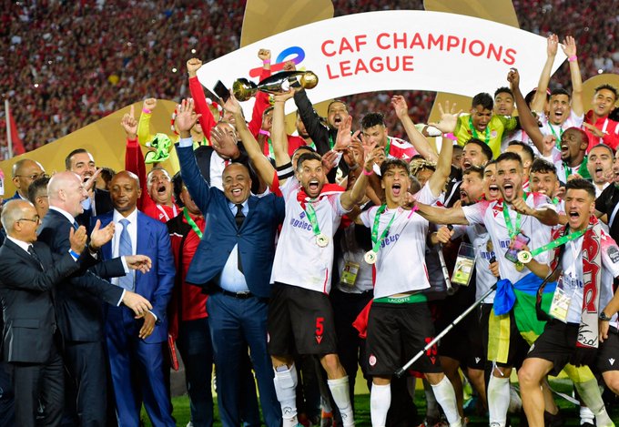 Wydad AC celebrate with the CAF Champions League trophy.
