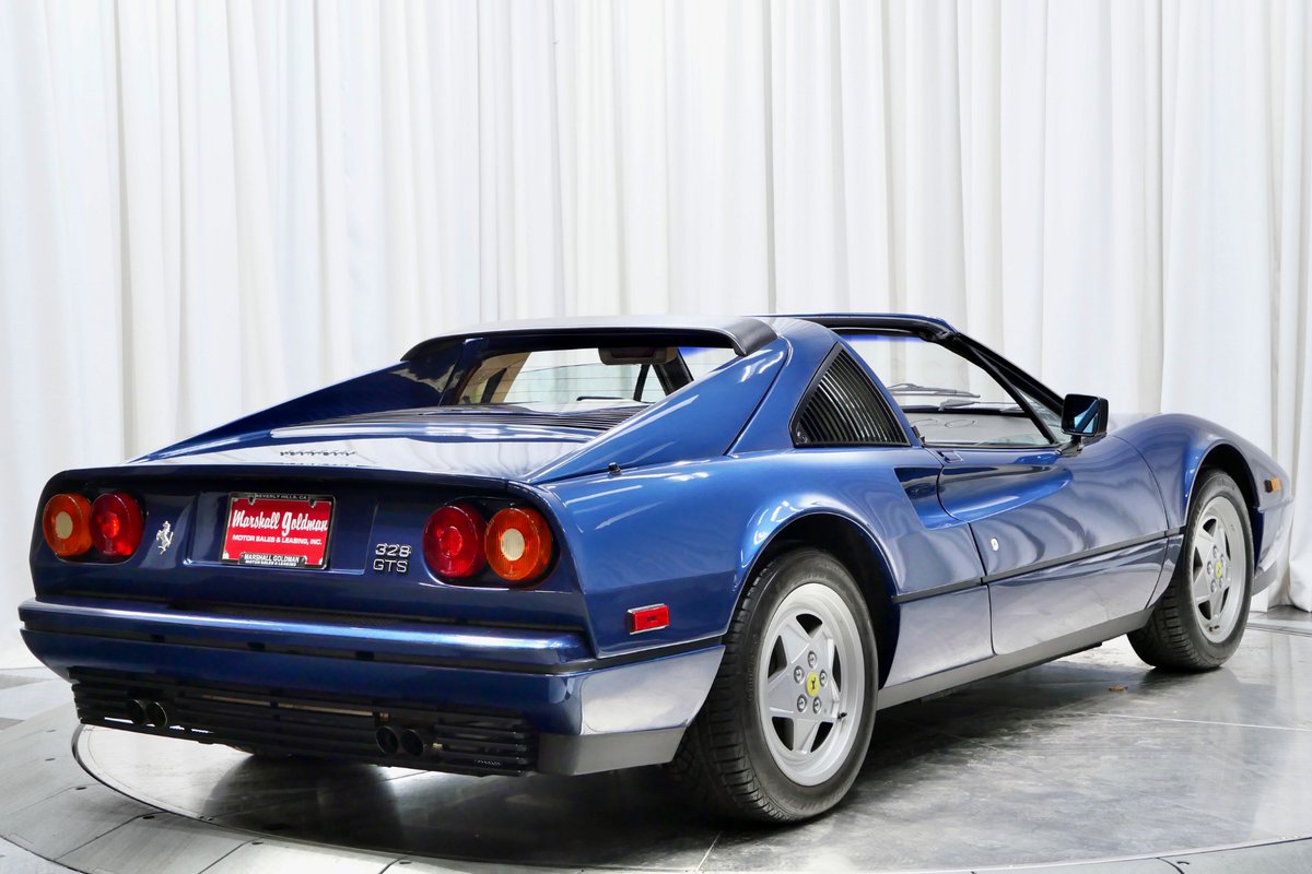 MarshallGoldmBH's tweet image. This 1989 Ferrari 328 GTS is a showstopper! With a 3.2L V8, the legendary gated 5-speed manual, and upgrades like ABS, revised suspension, and those sleek convex wheels, this final-year 328 is driving perfection. #FerrariFun #Icon 

🔗: bit.ly/3ODw8bl