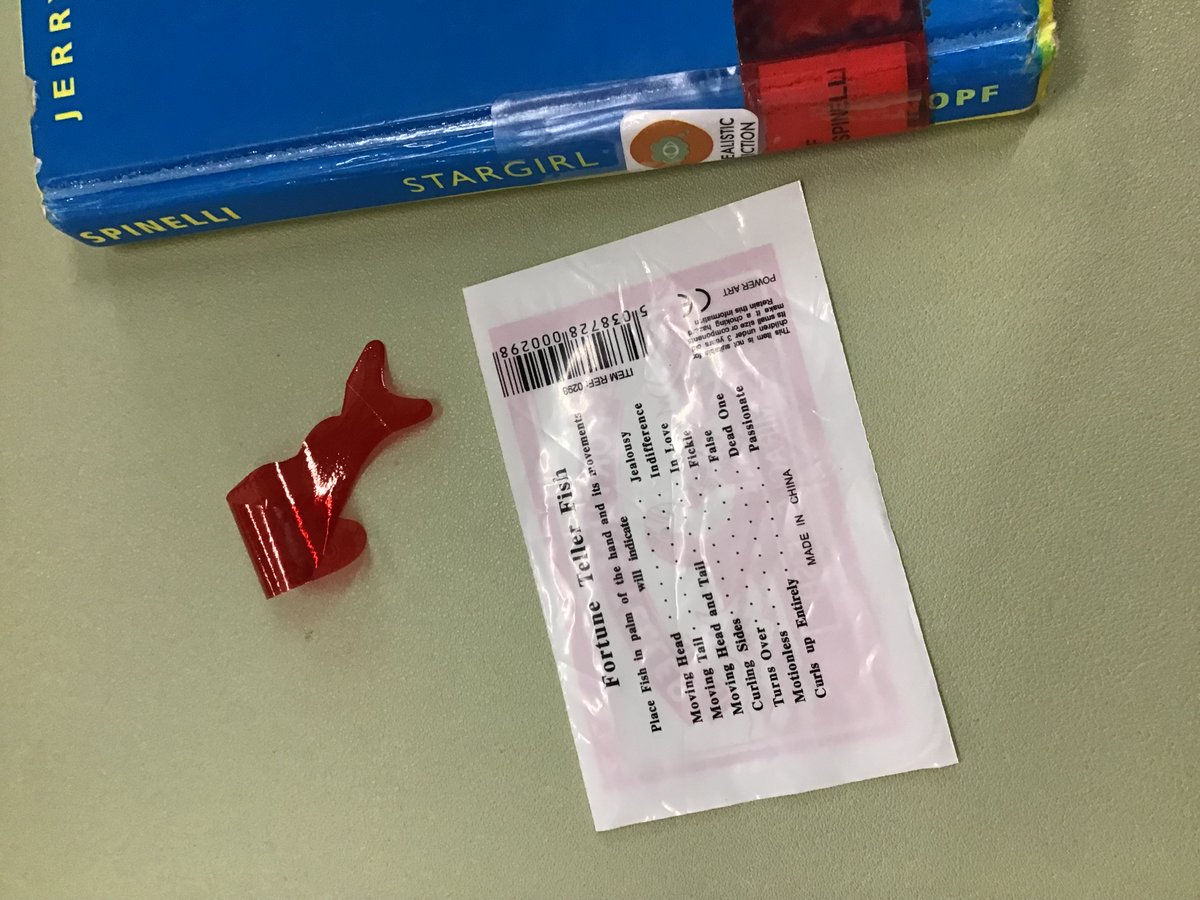 Sometimes the most interesting artifacts fall out of our books when we check them in. Today we were  fortune telling w this Miracle Fish we found in Jerry Spinelli’s Stargirl. We’re very passionate in the library, since the fish curled up in our hands. Passionate about reading!