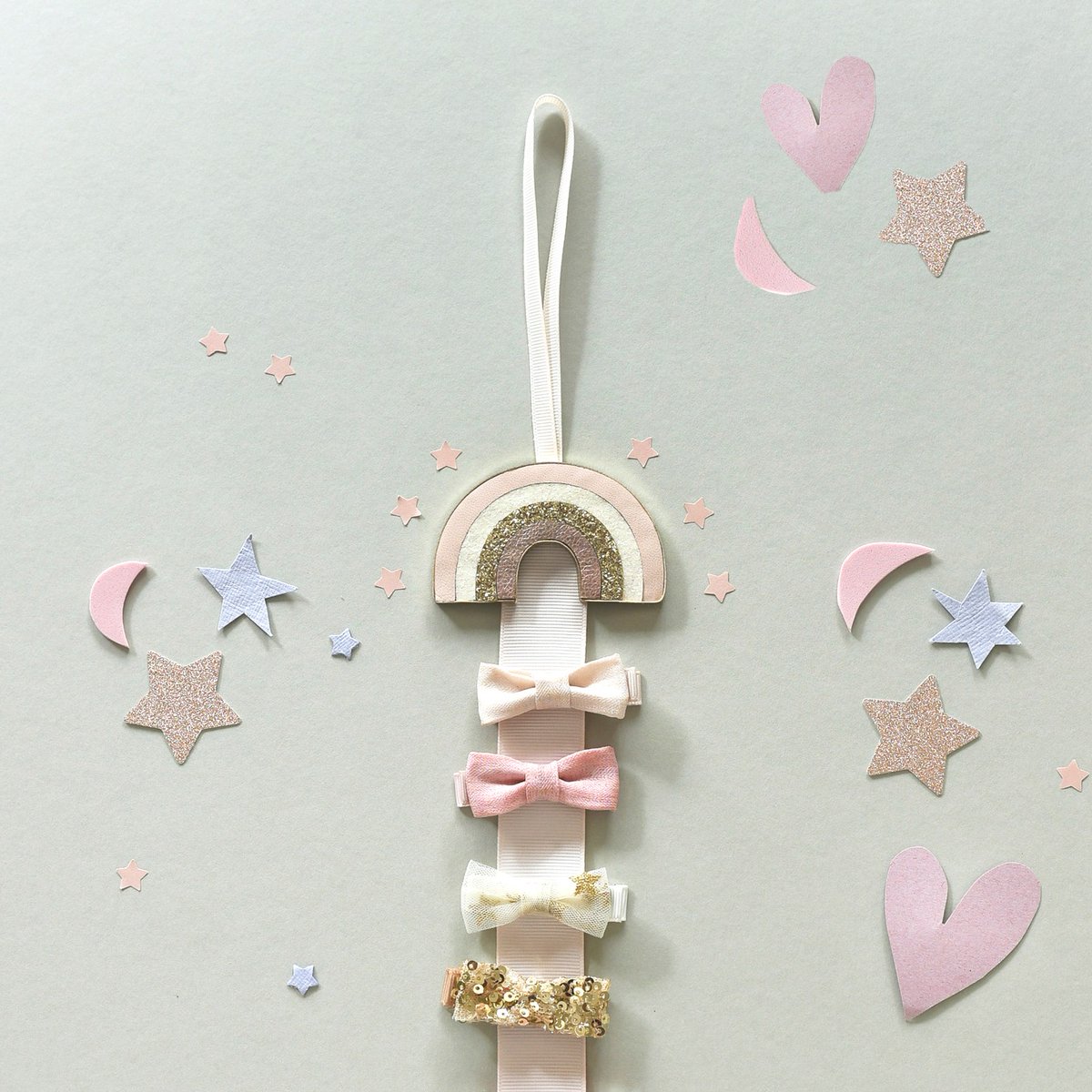 Say goodbye to messy hair clips! ✨ Our Rockahula clip hangers are here to save the day! With a handy hanging loop, they’re perfect for keeping all your clips in one place, just snap them on and they’re ready to wear again! 🎀 

#hairaccessories #kidshair #christmasgifting