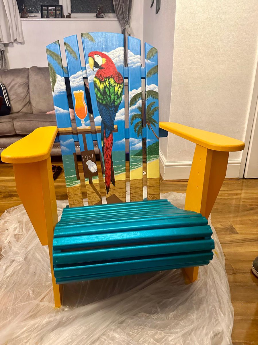 fazakerleyite's tweet photo. Made up with this for my 40th birthday. I saw something similar many years ago in a @Margaritaville and I commented I’d love to own one. My in-laws found a hand made version of the chair, together they stripped the varnish, sanded, primed, designed &amp; @Kirsty_art painted this https://t.co/8I4ffQApau