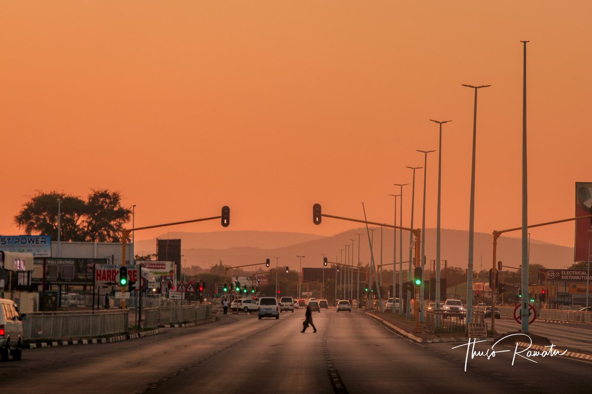 The crossing! A man crosses the street around sunrise time, and that's the thing about survival, whether you feel like going to work or not, the need to survive, the need to provide for yourself and family, will force you to get up &amp; cross that road

#photographybythusoramatu