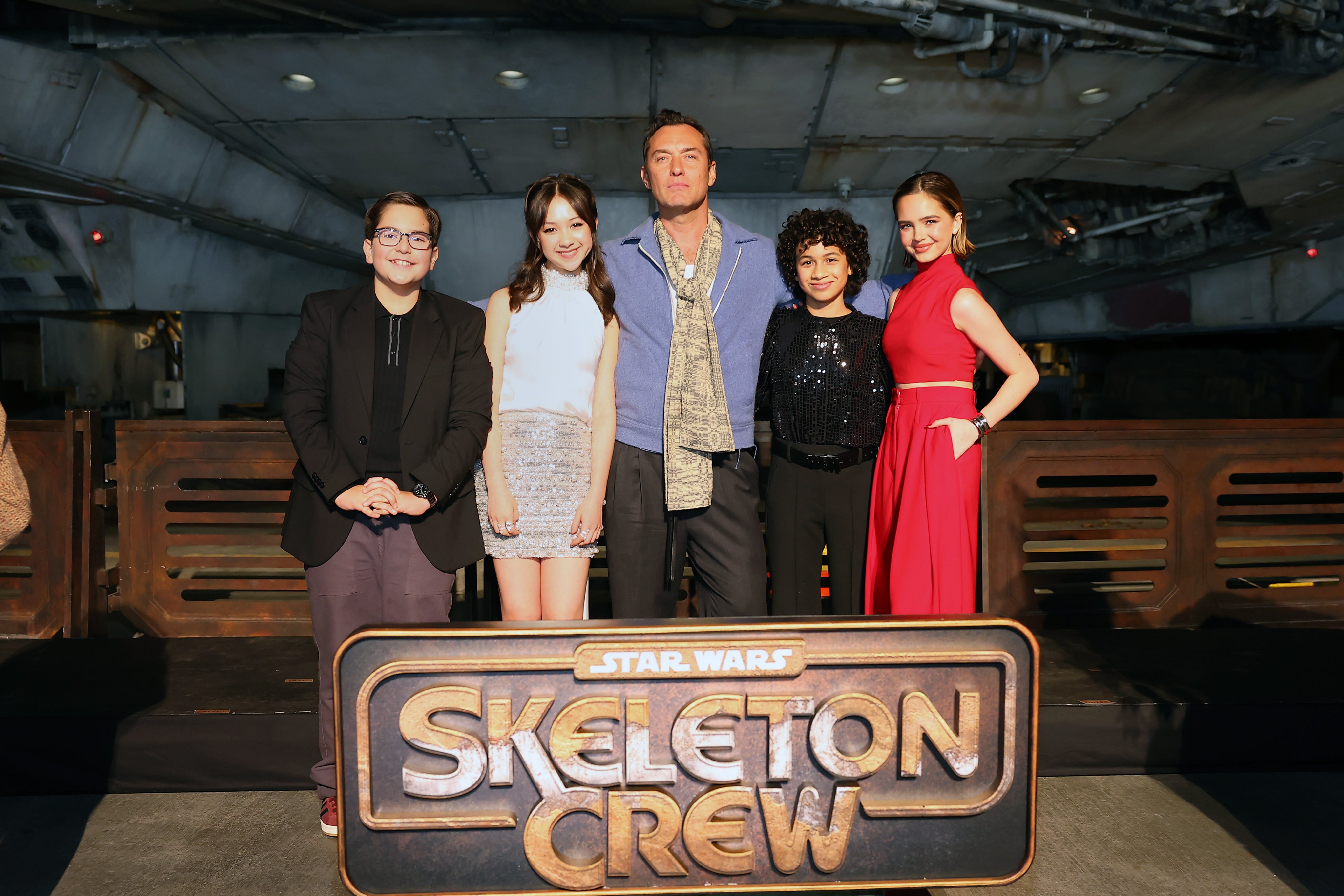 (L-R) Robert Timothy Smith, Kyriana Kratter, Jude Law, Ravi Cabot-Conyers, and Ryan Kiera Armstrong attend the Star Wars: Skeleton Crew launch event at Star Wars: Galaxy’s Edge at Disneyland Resort.
